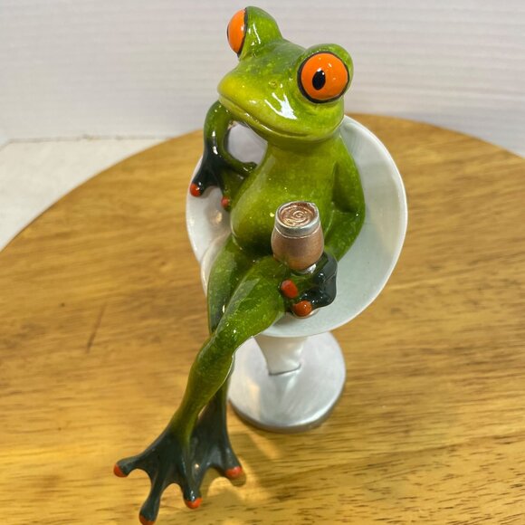 Green Ceramic Frog Figurine With Wine Glass Sitting In Modern White Chair - Picture 6 of 10